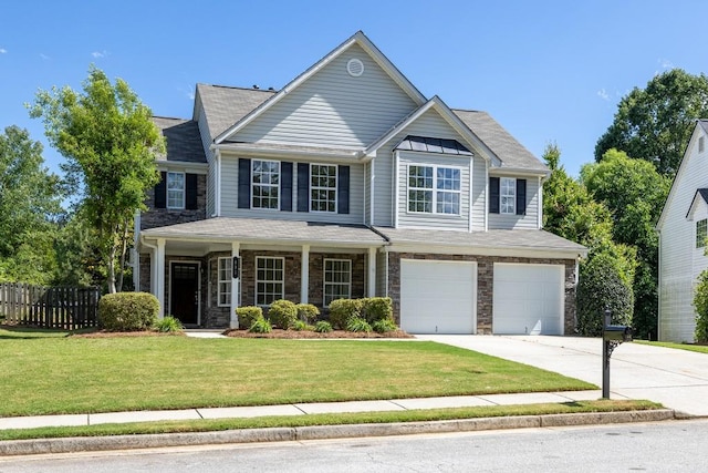 895 Roxfield Ct, Buford, GA 30518 - view of front of home with driveway, an attached garage, stone siding, and a porch