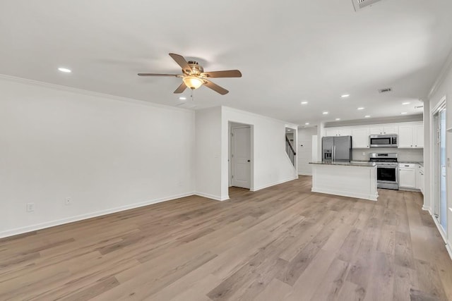 895 Roxfield Ct, Buford, GA 30518 - unfurnished living room featuring recessed lighting, ceiling fan, ornamental molding, light wood-type flooring, and stairs