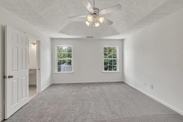 895 Roxfield Ct, Buford, GA 30518 - unfurnished bedroom with a textured ceiling, carpet, baseboards, a ceiling fan, and ensuite bath