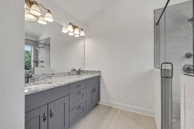 895 Roxfield Ct, Buford, GA 30518 - bathroom featuring double vanity, a stall shower, baseboards, vaulted ceiling, and tile patterned flooring