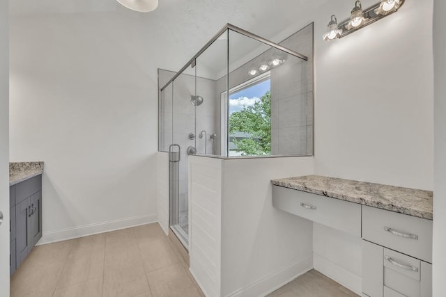 895 Roxfield Ct, Buford, GA 30518 - bathroom with vanity, a stall shower, and baseboards