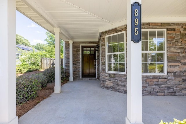 895 Roxfield Ct, Buford, GA 30518 - doorway to property featuring stone siding and a porch