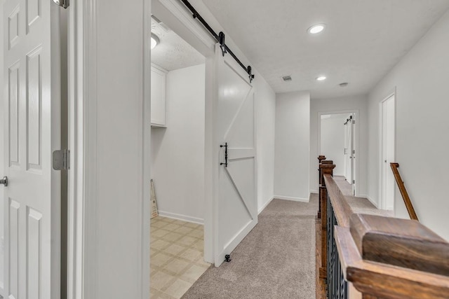 895 Roxfield Ct, Buford, GA 30518 - corridor with a barn door, recessed lighting, baseboards, and light floors