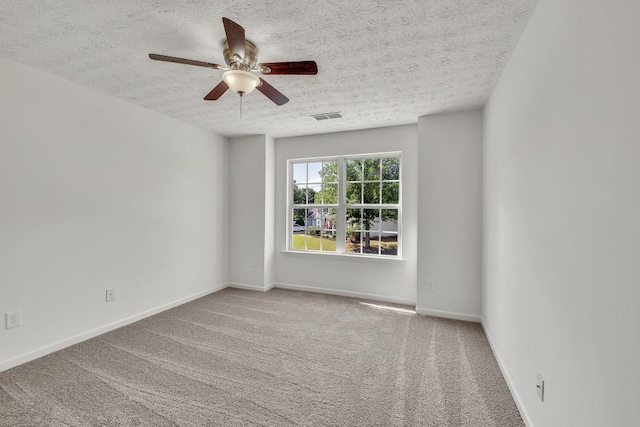 895 Roxfield Ct, Buford, GA 30518 - carpeted spare room featuring a textured ceiling, a ceiling fan, and baseboards