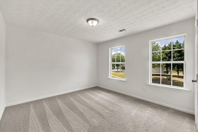 895 Roxfield Ct, Buford, GA 30518 - empty room featuring carpet flooring, baseboards, and a textured ceiling
