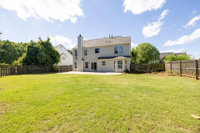 895 Roxfield Ct, Buford, GA 30518 - rear view of house featuring a patio area and a chimney