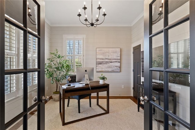 office area featuring french doors, baseboards, ornamental molding, and a chandelier