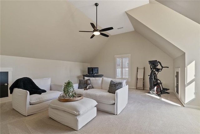 living area featuring light carpet, lofted ceiling, and ceiling fan