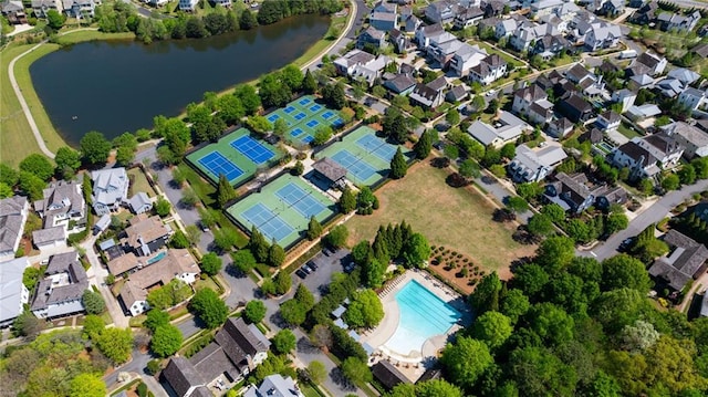 birds eye view of property featuring a residential view and a water view