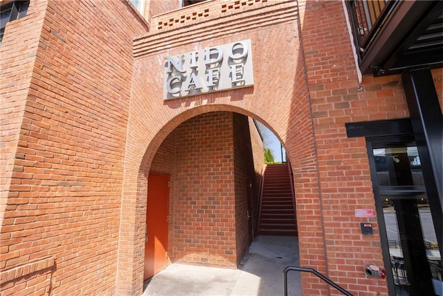 entrance to property with brick siding