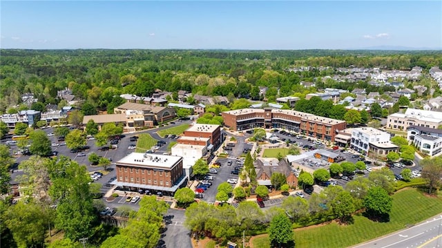 birds eye view of property with a forest view