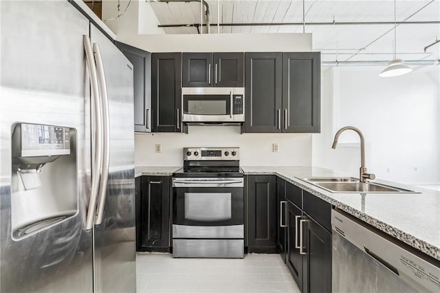 881 Memorial Dr SE Unit 307, Atlanta, GA 30316 - kitchen featuring stainless steel appliances, a sink, and dark cabinets