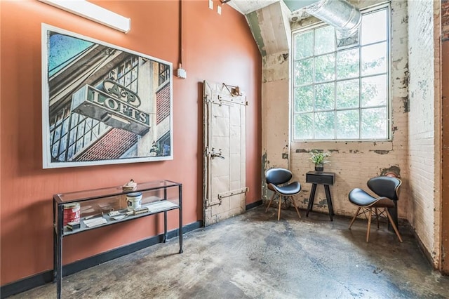 881 Memorial Dr SE Unit 307, Atlanta, GA 30316 - sitting room with concrete flooring and healthy amount of natural light