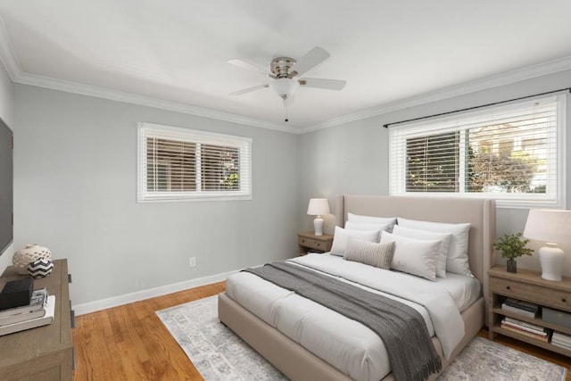 bedroom with multiple windows, ceiling fan, light hardwood / wood-style floors, and ornamental molding