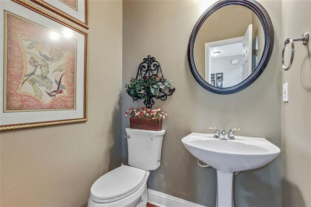 2073 Woodside Park Dr, Woodstock, GA 30188 - bathroom featuring toilet and baseboards