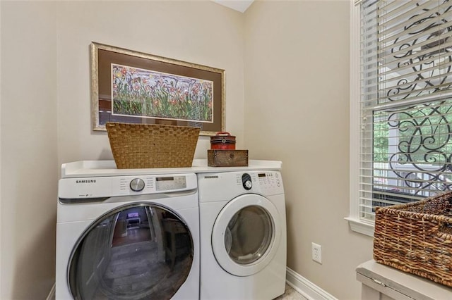 2073 Woodside Park Dr, Woodstock, GA 30188 - laundry area with washer and clothes dryer and baseboards