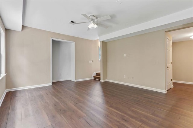 2073 Woodside Park Dr, Woodstock, GA 30188 - spare room featuring a ceiling fan, dark wood-style floors, and stairs