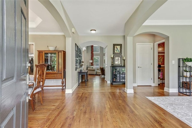 2073 Woodside Park Dr, Woodstock, GA 30188 - foyer featuring light wood-style flooring and ornamental molding