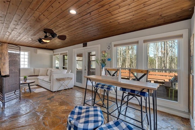 interior space featuring a wall unit AC, wood ceiling, and french doors