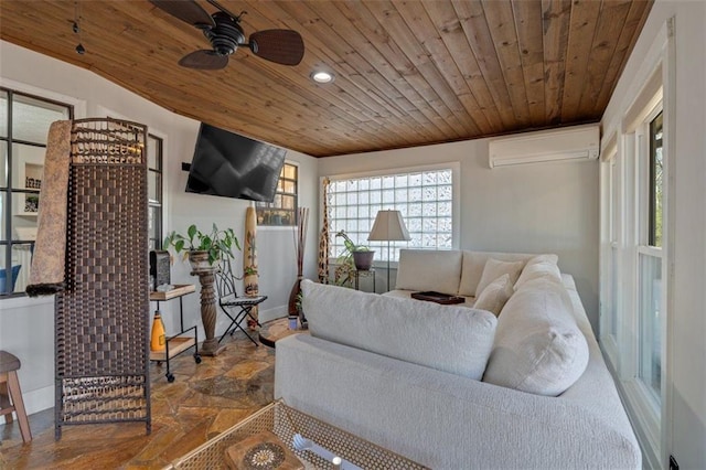 living room with wooden ceiling, baseboards, an AC wall unit, stone finish flooring, and crown molding