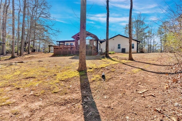 view of yard with a wooden deck