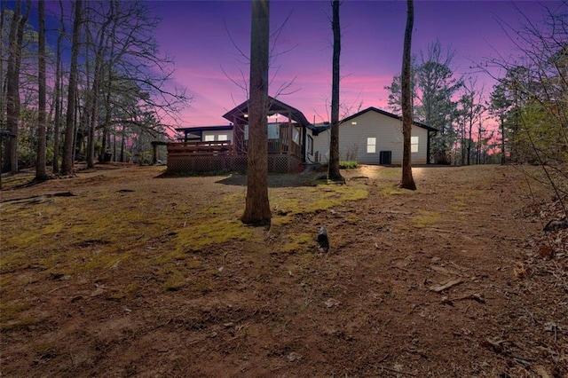 view of yard with a wooden deck