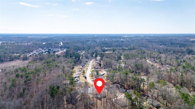 bird's eye view featuring a forest view