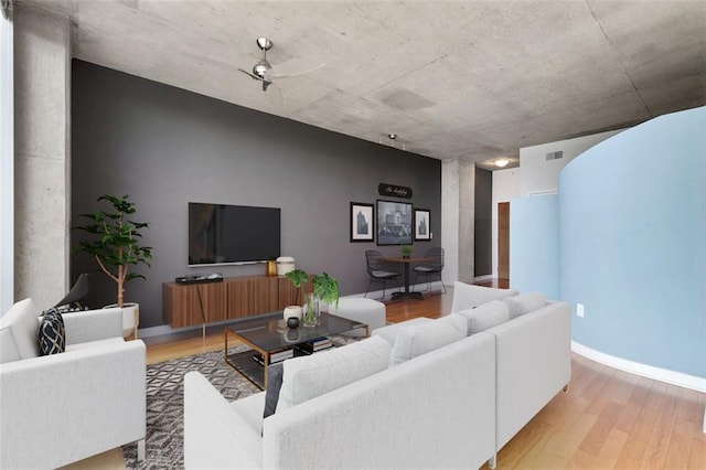 3300 Windy Ridge Parkway SE Unit 1107, Atlanta, GA 30339 - living room featuring light wood-style flooring, ceiling fan, and baseboards