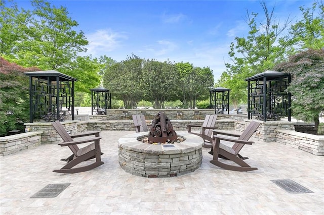 3300 Windy Ridge Parkway SE Unit 1107, Atlanta, GA 30339 - view of patio featuring a fire pit and a gazebo