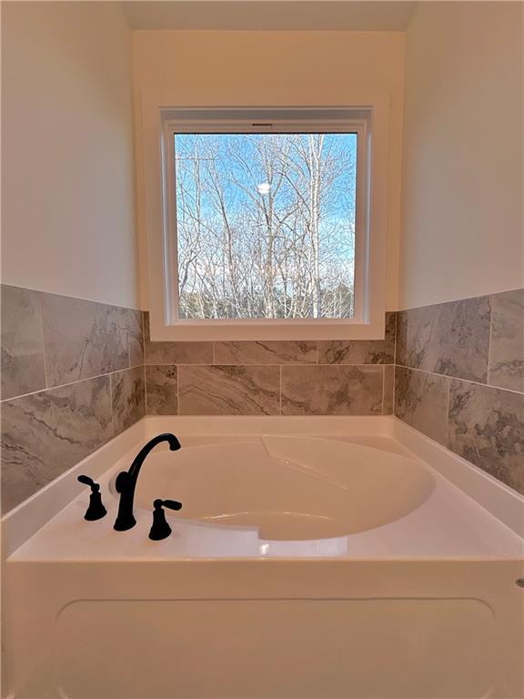 bathroom featuring a garden tub