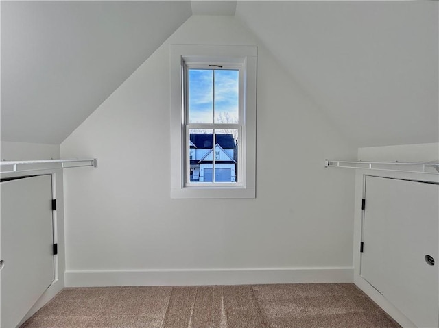 washroom featuring carpet and baseboards