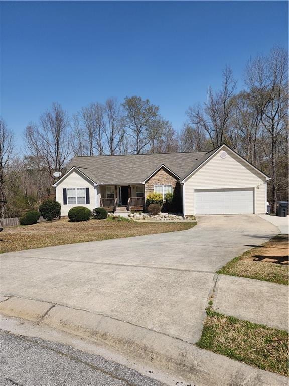 210 Vintage Dr, Covington, GA 30014 - ranch-style house with a porch, a garage, and driveway