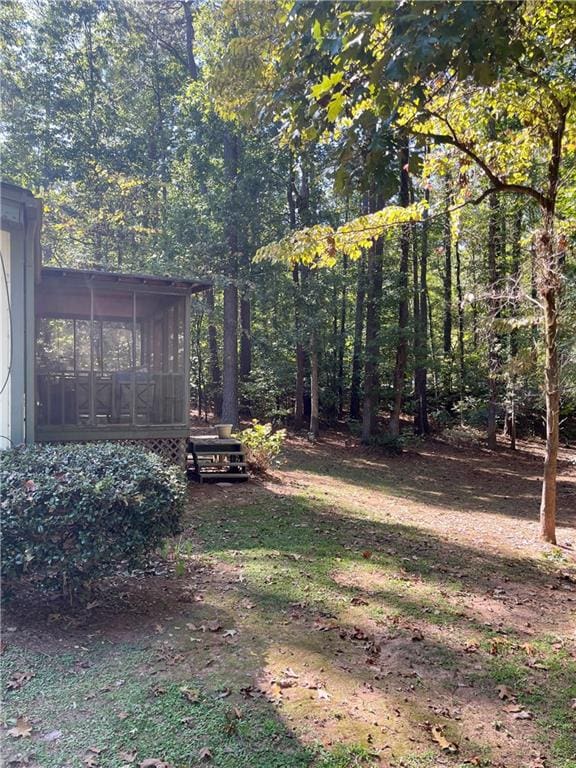 view of yard with a sunroom