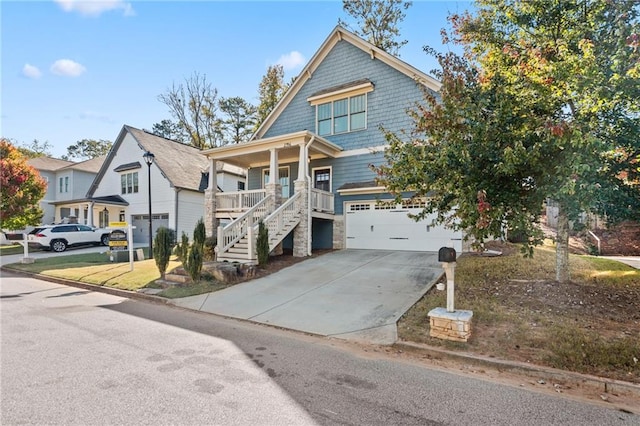 view of front of home with covered porch and a garage