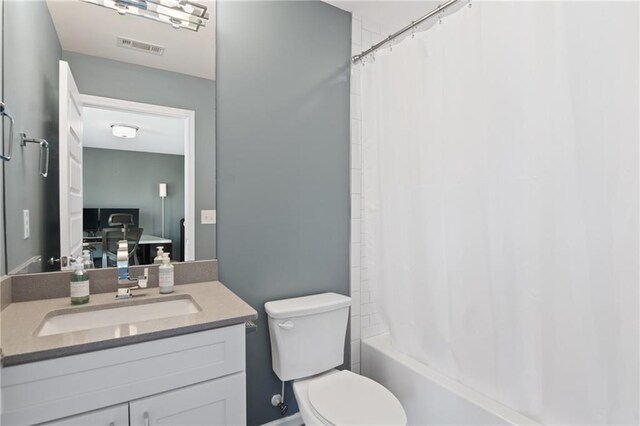 full bathroom with vanity, toilet, and shower / bath combination with curtain