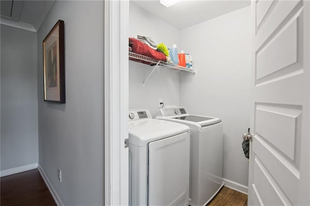 washroom featuring washer and dryer and dark hardwood / wood-style floors