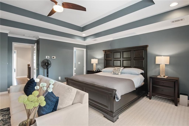 carpeted bedroom with crown molding, a raised ceiling, and ceiling fan