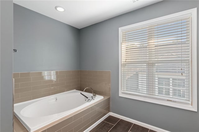 bathroom featuring tiled tub