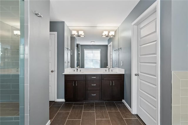 bathroom featuring vanity and a tile shower