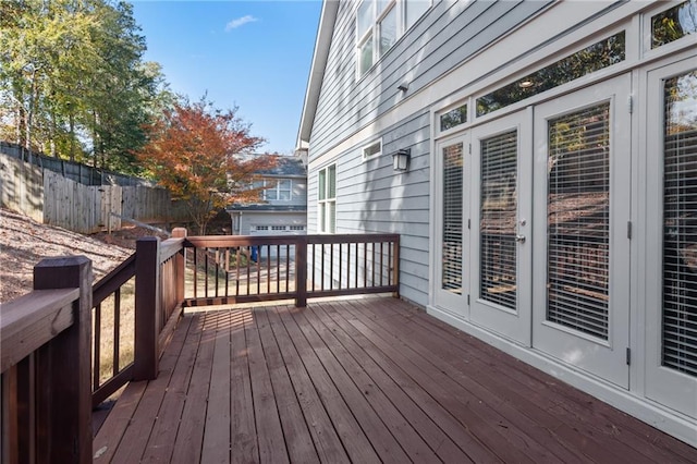 wooden deck featuring french doors