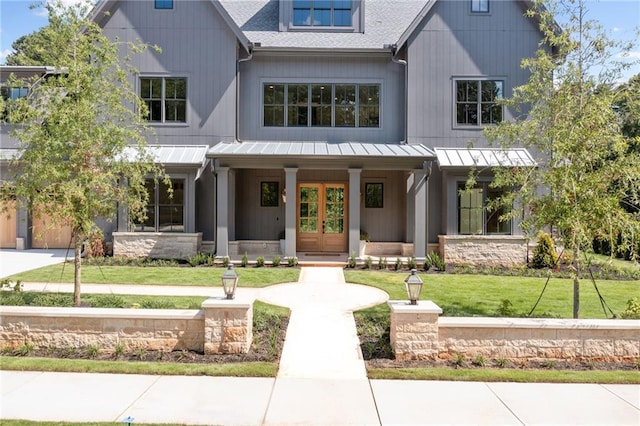 view of front of house with a front lawn and covered porch