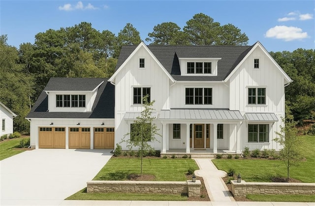 115 Baxley Ln, Alpharetta, GA 30004 - modern farmhouse style home with concrete driveway, roof with shingles, board and batten siding, a front yard, and covered porch