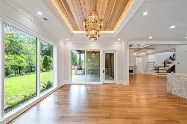 115 Baxley Ln, Alpharetta, GA 30004 - interior space featuring ornamental molding, a fireplace, stairway, light wood-style floors, and ceiling fan with notable chandelier