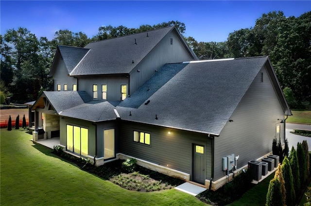 115 Baxley Ln, Alpharetta, GA 30004 - back of property featuring a yard, cooling unit, a patio, and roof with shingles