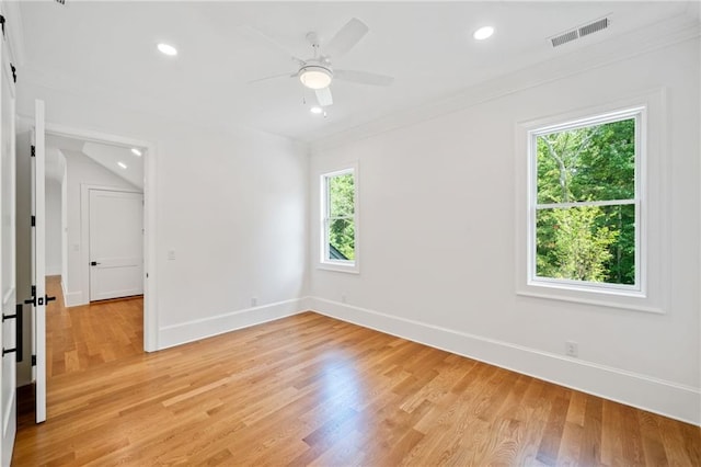 115 Baxley Ln, Alpharetta, GA 30004 - empty room with light wood-style flooring, visible vents, baseboards, and a healthy amount of sunlight