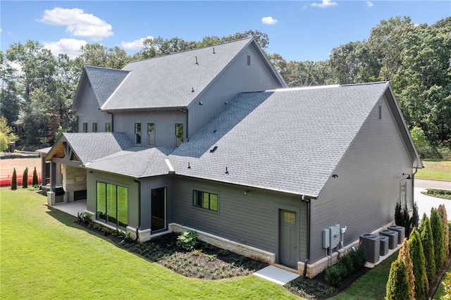 115 Baxley Ln, Alpharetta, GA 30004 - back of house featuring a patio, a shingled roof, central air condition unit, and a lawn