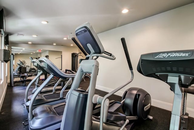 gym with recessed lighting and baseboards