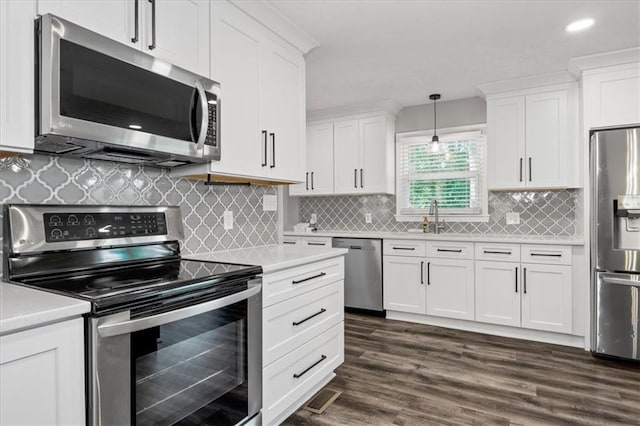 71 Seminole Trl SW, Cartersville, GA 30120 - kitchen featuring appliances with stainless steel finishes, light countertops, white cabinetry, a sink, and recessed lighting