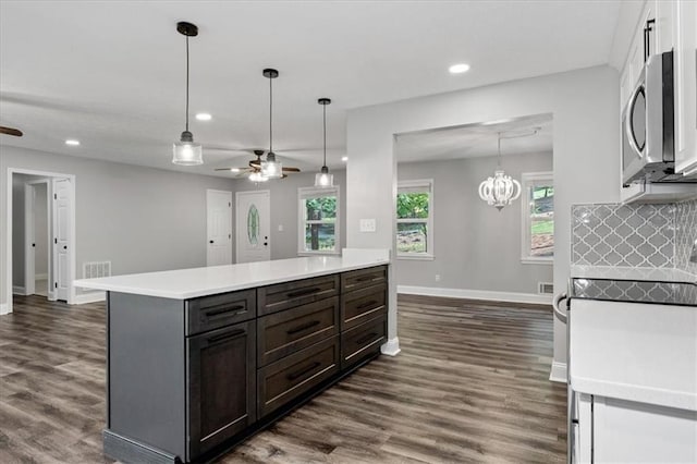71 Seminole Trl SW, Cartersville, GA 30120 - kitchen featuring stainless steel microwave, ceiling fan, recessed lighting, dark wood finished floors, and healthy amount of natural light