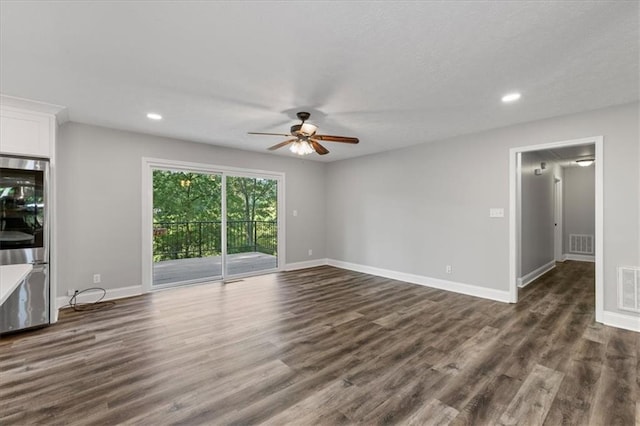 71 Seminole Trl SW, Cartersville, GA 30120 - unfurnished living room featuring a ceiling fan, dark wood-style flooring, baseboards, and recessed lighting